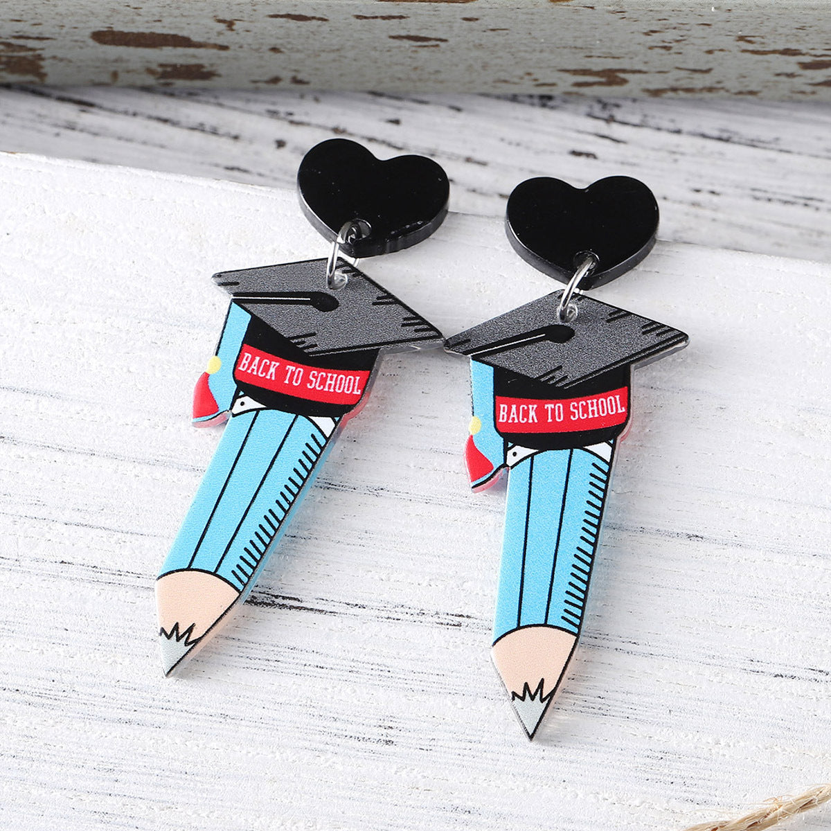 Acrylic pendant earrings for the graduation season of the school season
